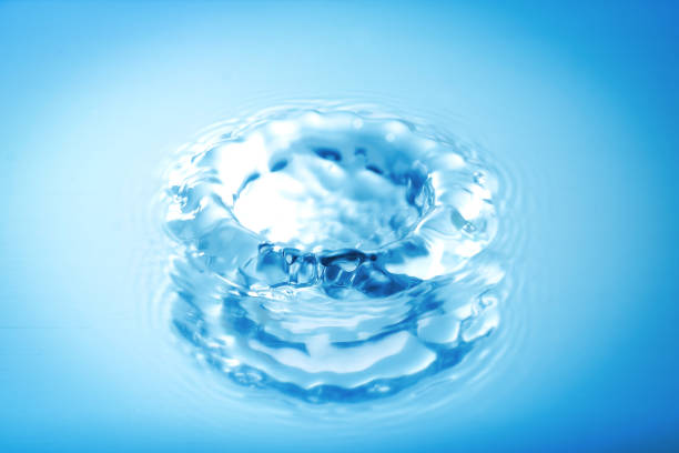 istock Water splashing droplets with water ripples ,Blue Tone 638394614