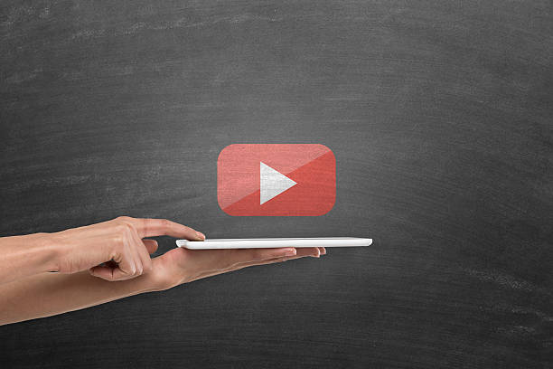 istock Digital tablet with you tube play icon on blackboard 638396074
