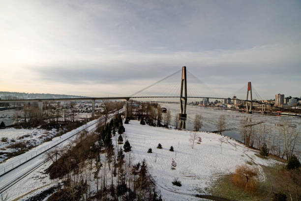 istock snow on a park and on railway by a river 638396776