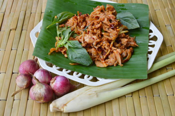 istock spicy chicken ligament salad on banana leaf 638396894
