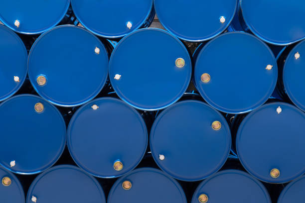 blue steel chemical tanks or oil tanks stacked in row. blue steel chemical tanks or oil tanks stacked in a row. background and texture north sea oil and gas stock pictures, royalty-free photos & images