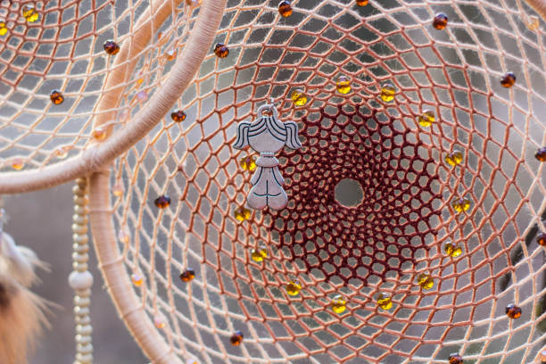 istock Dreamcatcher made of feathers, leather, beads, and ropes 638401228
