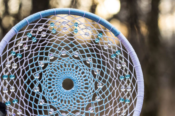 istock Dreamcatcher made of feathers, leather, beads, and ropes 638401428