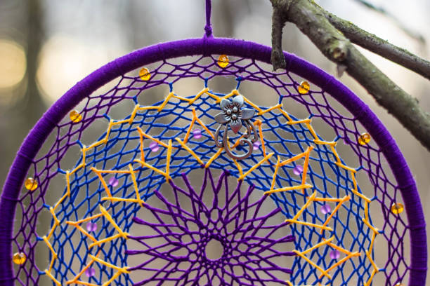 istock Dreamcatcher made of feathers, leather, beads, and ropes 638401470