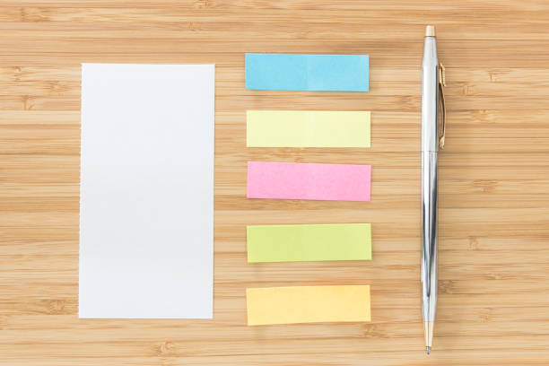 istock Notepaper, sticky notes and pen put on wooden desk 638401864