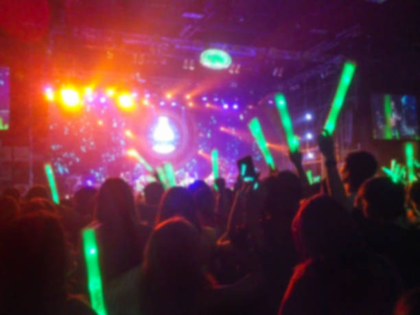 istock Defocused Of Rock Concert Lighting Stage Effect, Lighting Stick Crowd 638402060