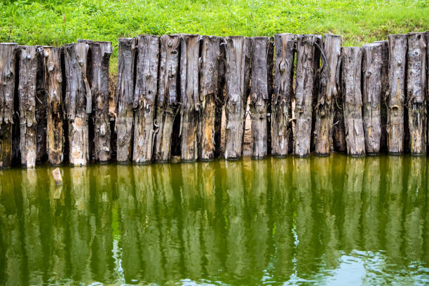 Old wooden fence in the canal