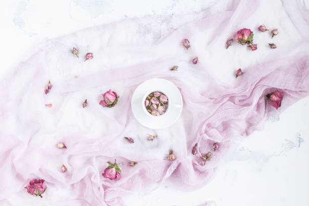 istock Composition with cup of tea and dried rose flowers 638404220