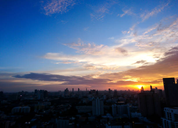 istock Texture of bright evening sky during sunset with city foreground 638404774
