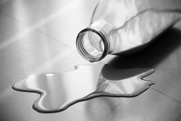istock Milk Bottle On The Wooden Ground 638404904