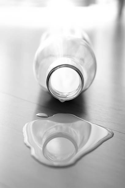 istock Milk Bottle On The Wooden Ground 638405282