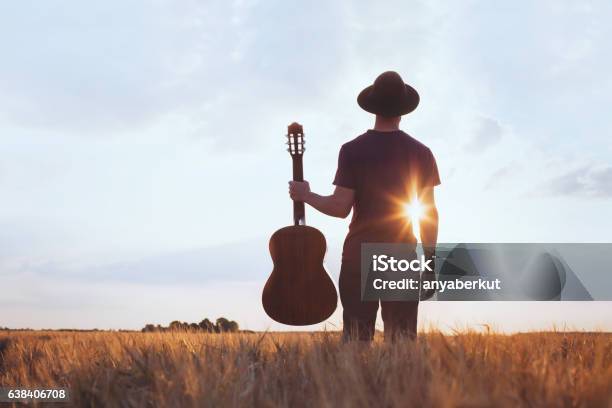 Music Festival Background Silhouette Of Musician Artist With Acoustic Guitar Stock Photo - Download Image Now