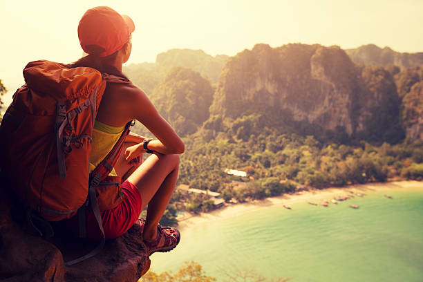 istock young woman backpacker hiking on seaside mountain 638406774