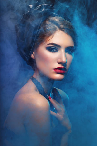 istock Beautiful girl with bright make-up and shawl on head 638408552