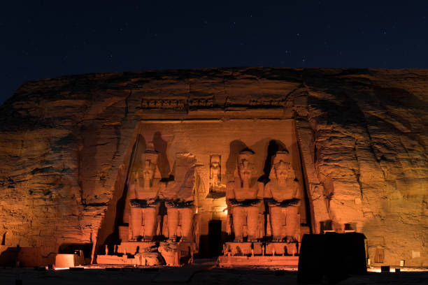 Abu Simbel And The Stars A long exposure night shot of Abu Simbel temple during the sound and light show.  amon photos stock pictures, royalty-free photos & images