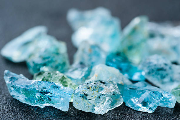 Collection of aquamarine crystals Collection of lovely blue uncut aquamarine gemstones. turquoise colored stock pictures, royalty-free photos & images