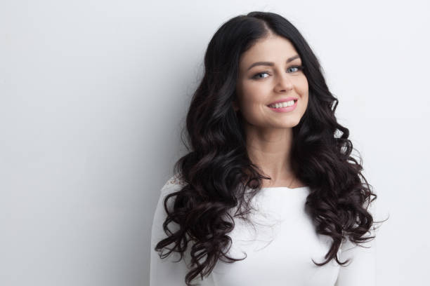 istock Woman with long curly black hair 638417142