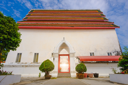 Old thai architecture of main ordination hall in Wat Pa la lai Public temple  with blue sky in Suphanburi city, Thailand