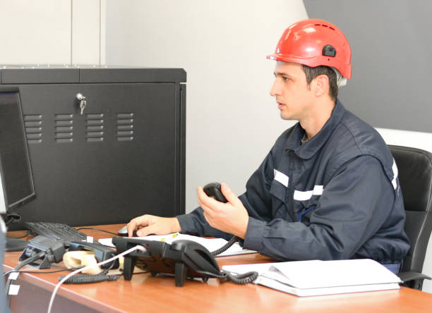 istock Communication Operator Talking on CB Radio in the Office 638421332