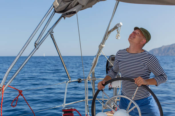 istock Young skipper on his sailing boat. 638422762