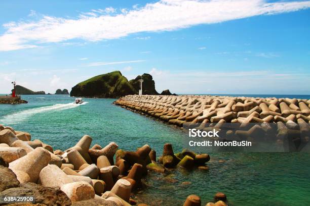 Breakwater Of Chagwido Jeju In Korea Stock Photo - Download Image Now - Blue, Building Exterior, Clear Sky