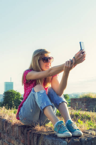 istock Girl making selfie outdoors. 638427256