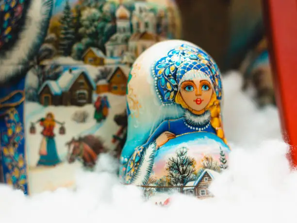 Photo of Blue nesting doll in the snow