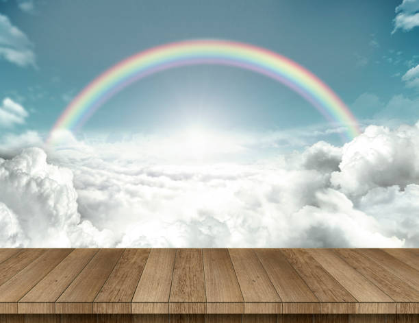 Wood table with rainbow stock photo