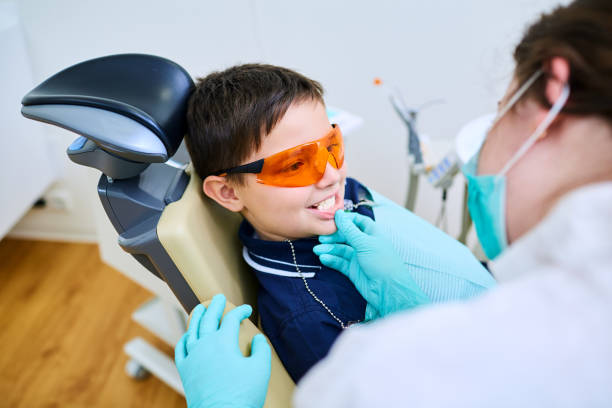 istock Boy child in orange glasses have a dentist 638437586