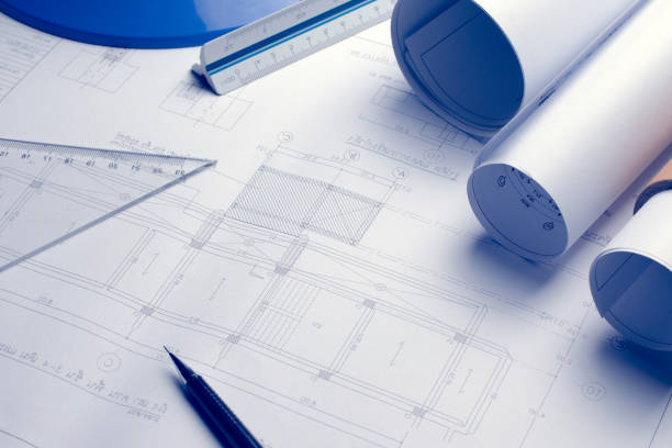istock Architectural blueprints and blueprint rolls and a drawing instr 638439332