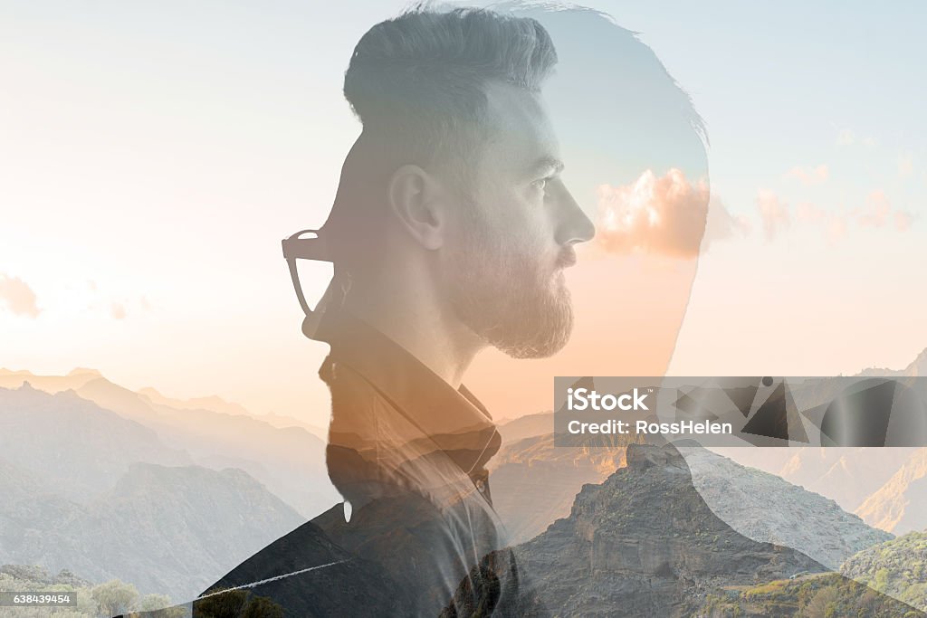 Double exposure portrait of a businessman Triple exposure portrait of a businessman combinated with beautiful mountain landscape on the sunset Multiple Exposure Stock Photo