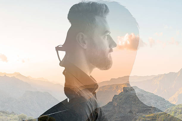 Double exposure portrait of a businessman Triple exposure portrait of a businessman combinated with beautiful mountain landscape on the sunset symmetry photos stock pictures, royalty-free photos & images