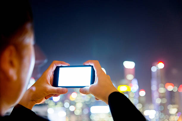 istock Businesswoman using mobile phone at night 638439804