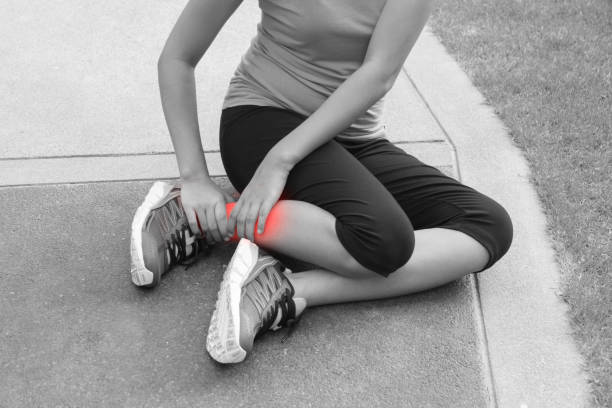 istock Sporty woman ankle sprain while jogging or running at park 638441004