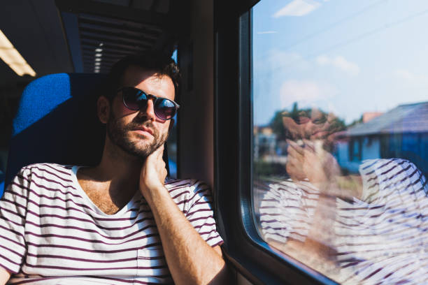 istock Young man traveling on a train 638441154