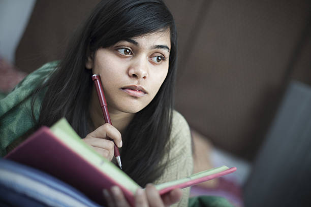 istock Girl student studying in bed at home. 638441768