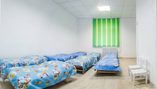 istock Kindergarten bedroom with blue beds. 638443896
