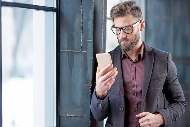 istock Business man with smart phone 638445266
