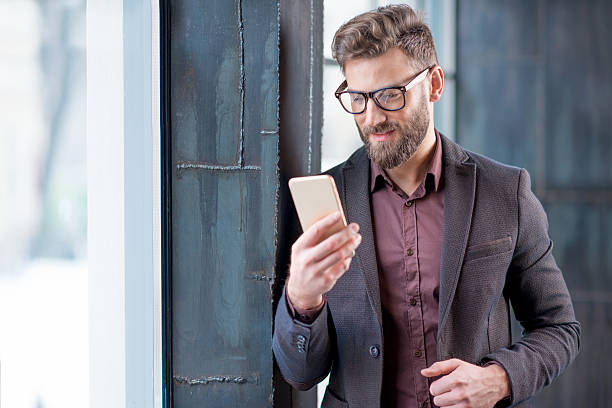 istock Business man with smart phone 638445514