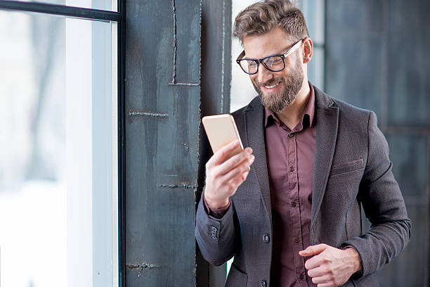 istock Business man with smart phone 638445668