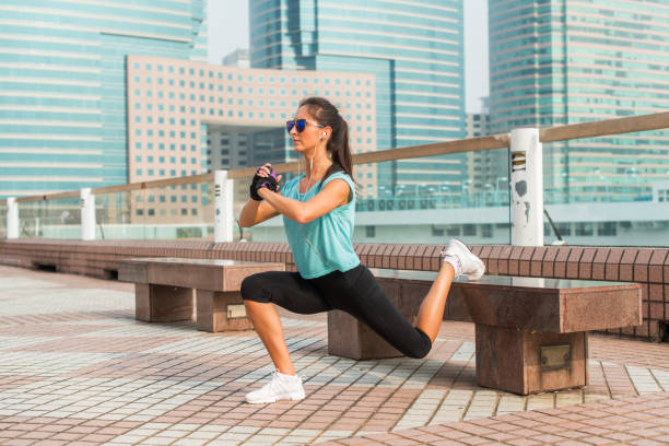 istock Sporty female athlete doing single leg lunge exercise on bench 638446622