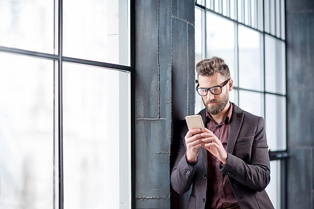 istock Business man with smart phone 638447118