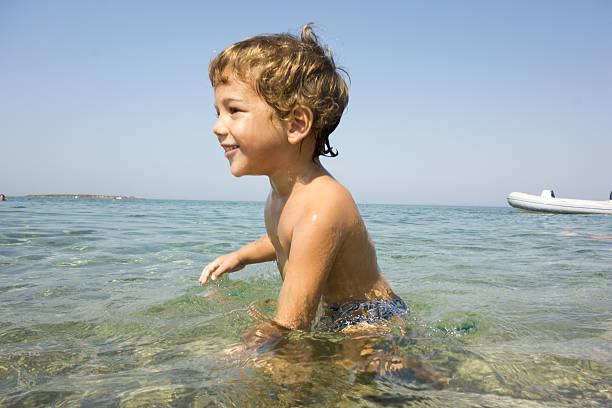 Little boy having fun in sea