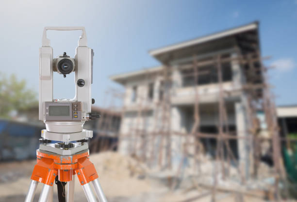 istock Survey equipment theodolite on a tripod. with building construct 638450900