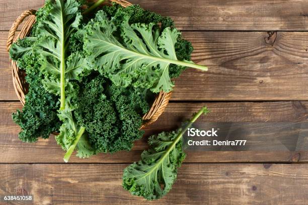 Leaves Of Raw Kale Above View Stock Photo - Download Image Now - Kale, Green Color, Wood - Material