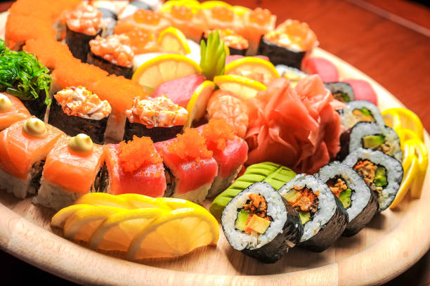 istock Nigiri sushi and  rolls with fish served on wooden table 638454996