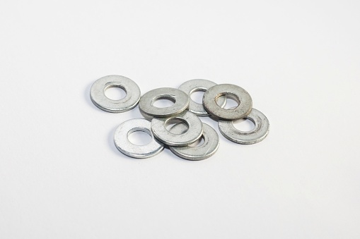 Used old washers and spring washers with isolated white background for commercial