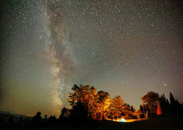 istock camping tent under stars at night 638455988