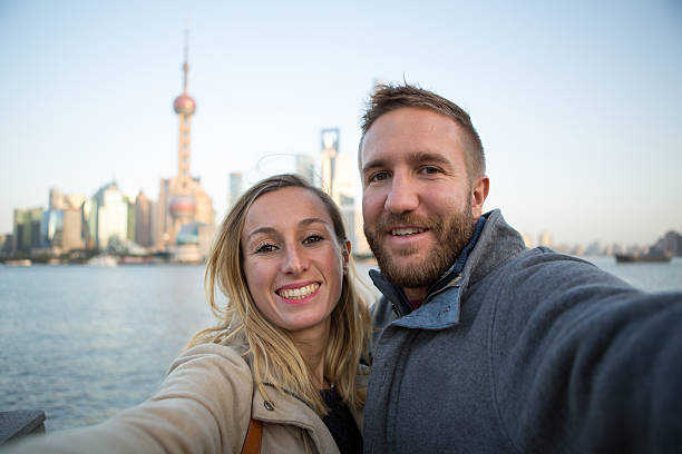 istock Young couple taking selfie in Shanghai 638456084