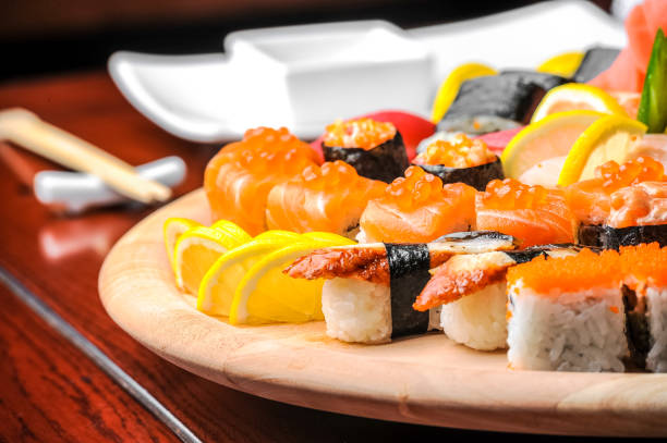 istock Nigiri sushi and  rolls with fish served on wooden table 638456124